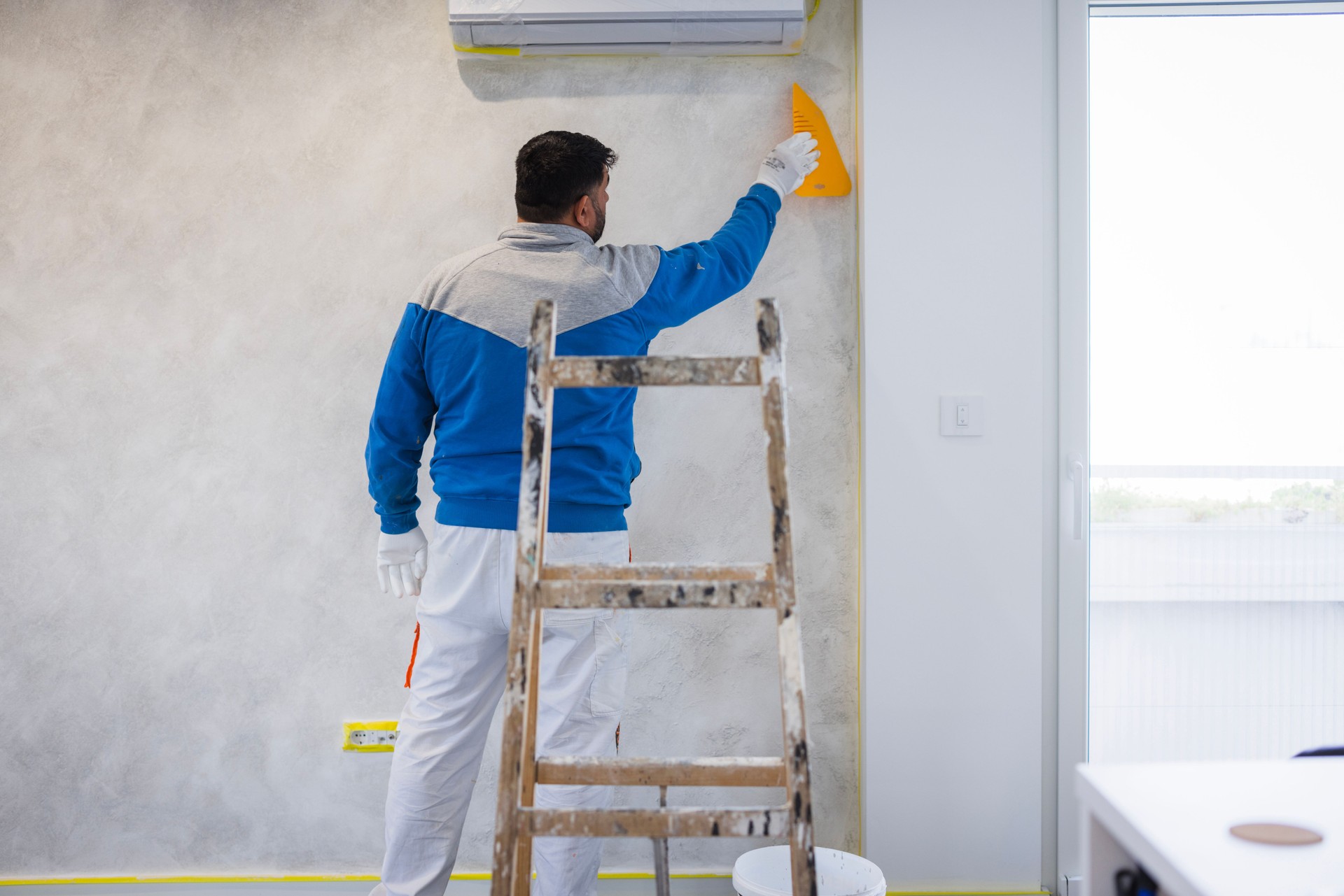 Construction worker doing inside walls